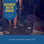 A person standing in a dirty room with a sign that says basement water damage