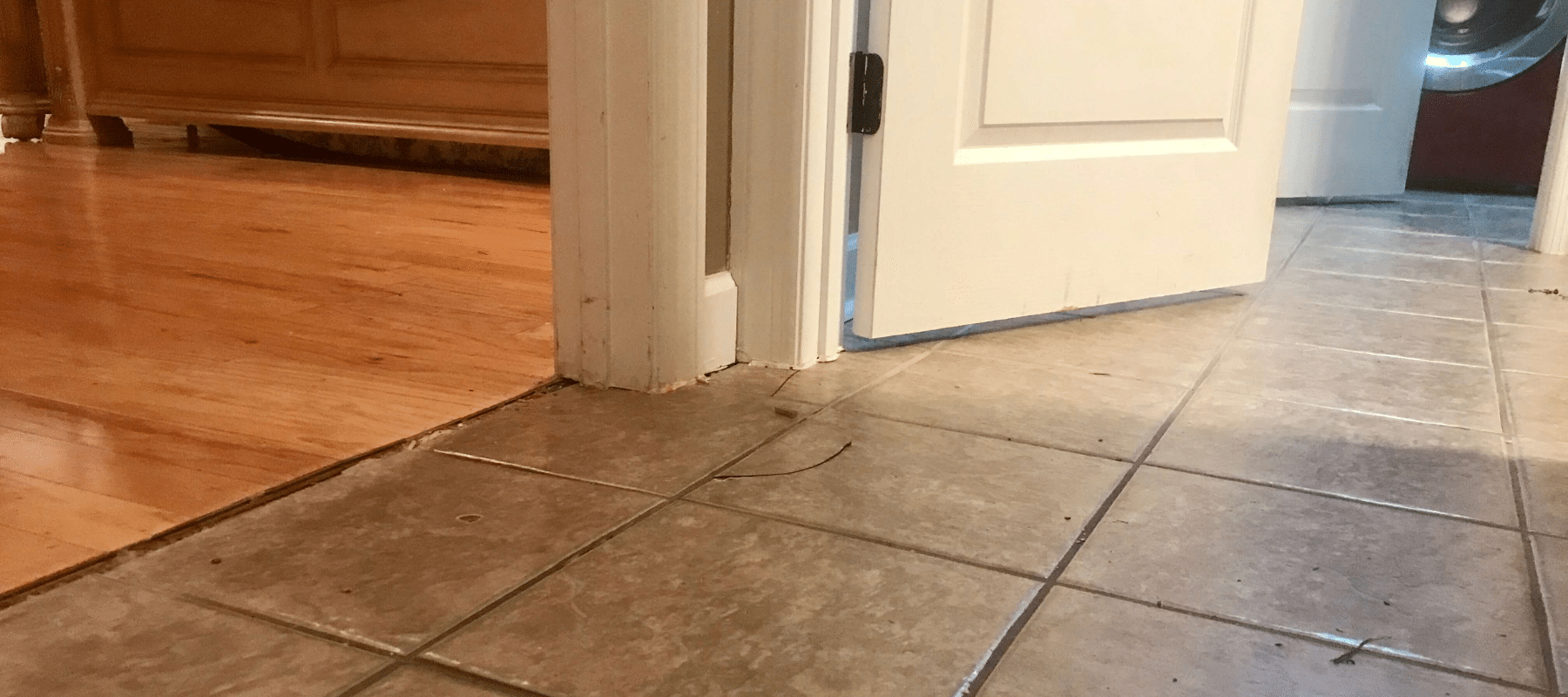 cracked tile on home's hallway