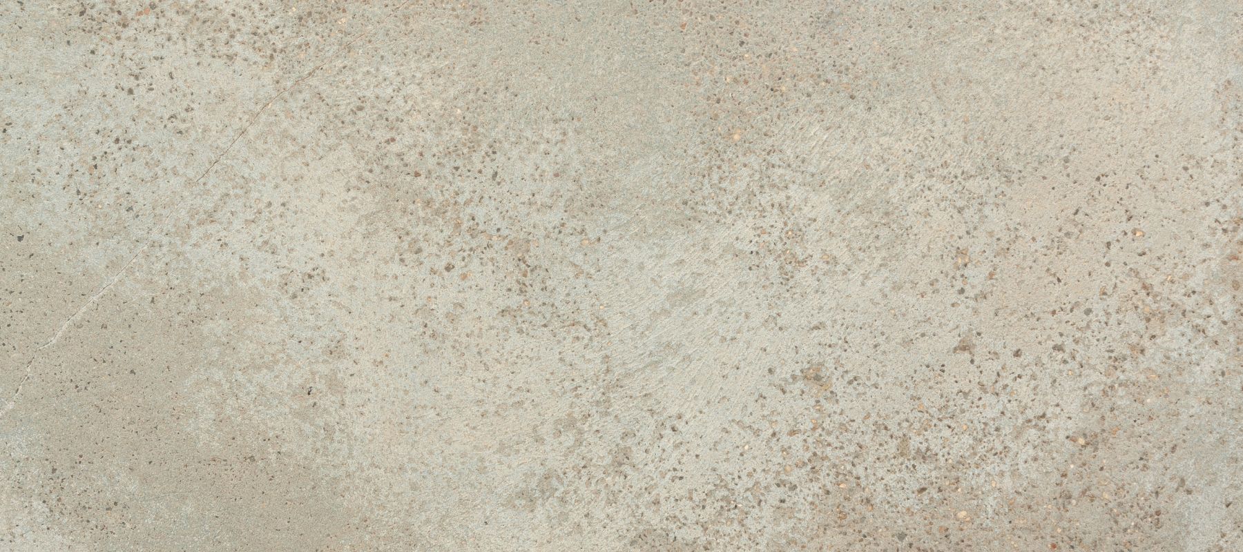 close-up of a concrete surface with a slightly rough texture and visible small cracks