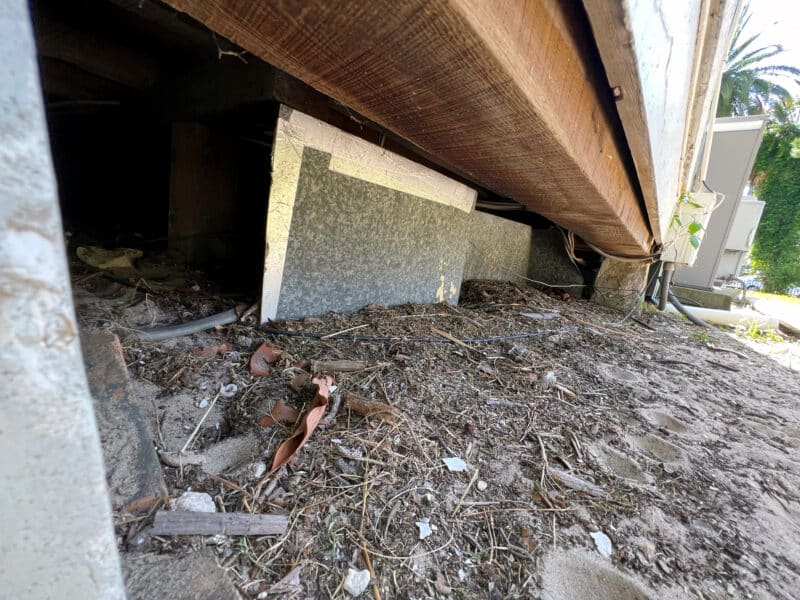 Dirty Ground Entrance to Crawl Space home